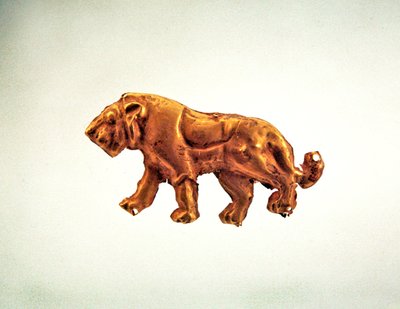 Striding lion, ornament from a funerary canopy, late 3rd millennium BC by Scythian